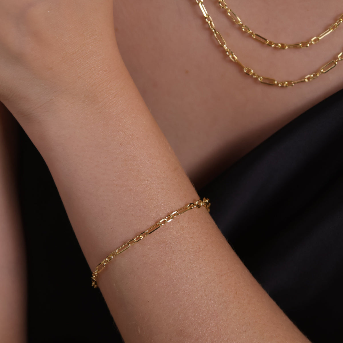18K gold filled 3x1 alternated paperclip bracelet showcased on a model's wrist, perfect for contemporary jewelry styling.