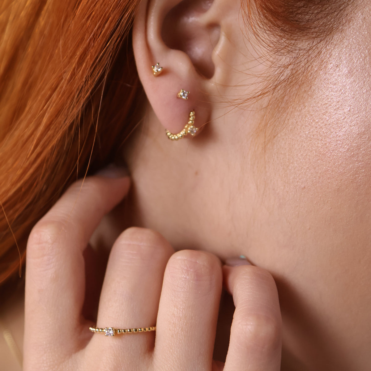 Solitaire CZ 2mm Stud Earrings in 18K gold-filled, view 3