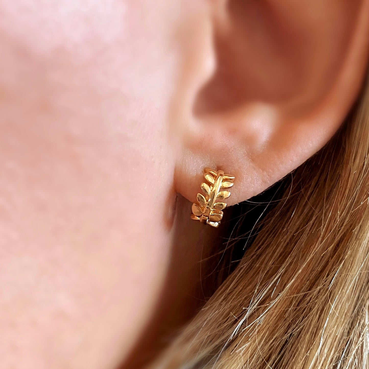 Skillus Leaf Huggie Hoop Earrings on ear