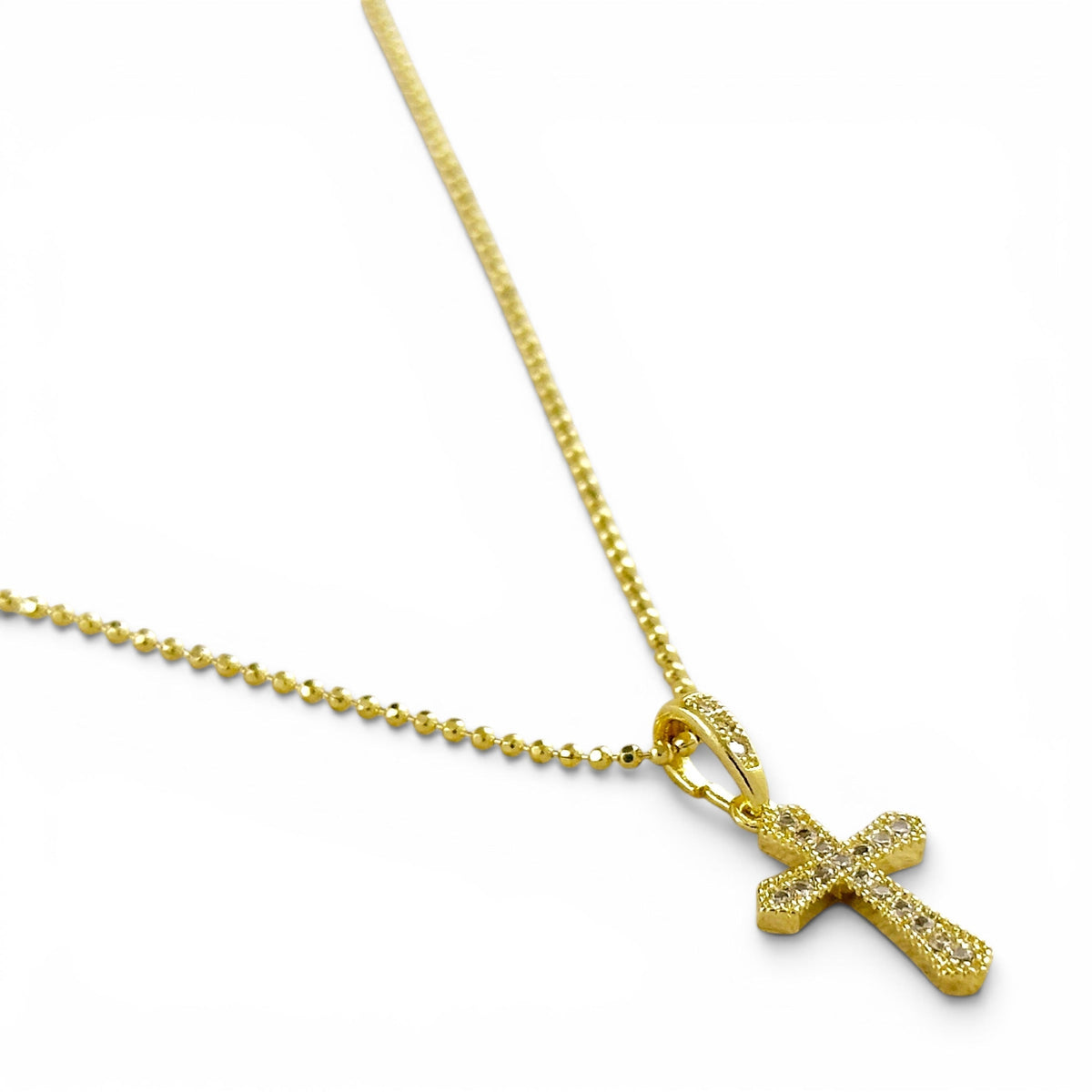 Close-up of fully pavé cubic zirconia stones on 21mm cross pendant