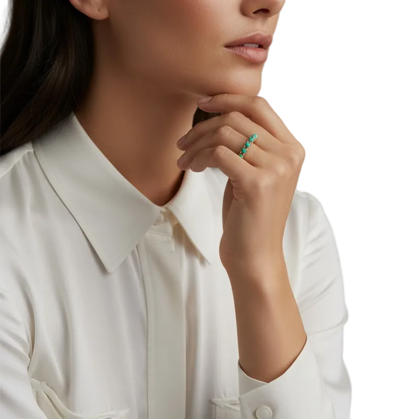 Woman wearing a white  western shirt and  a turquoise stone ring

