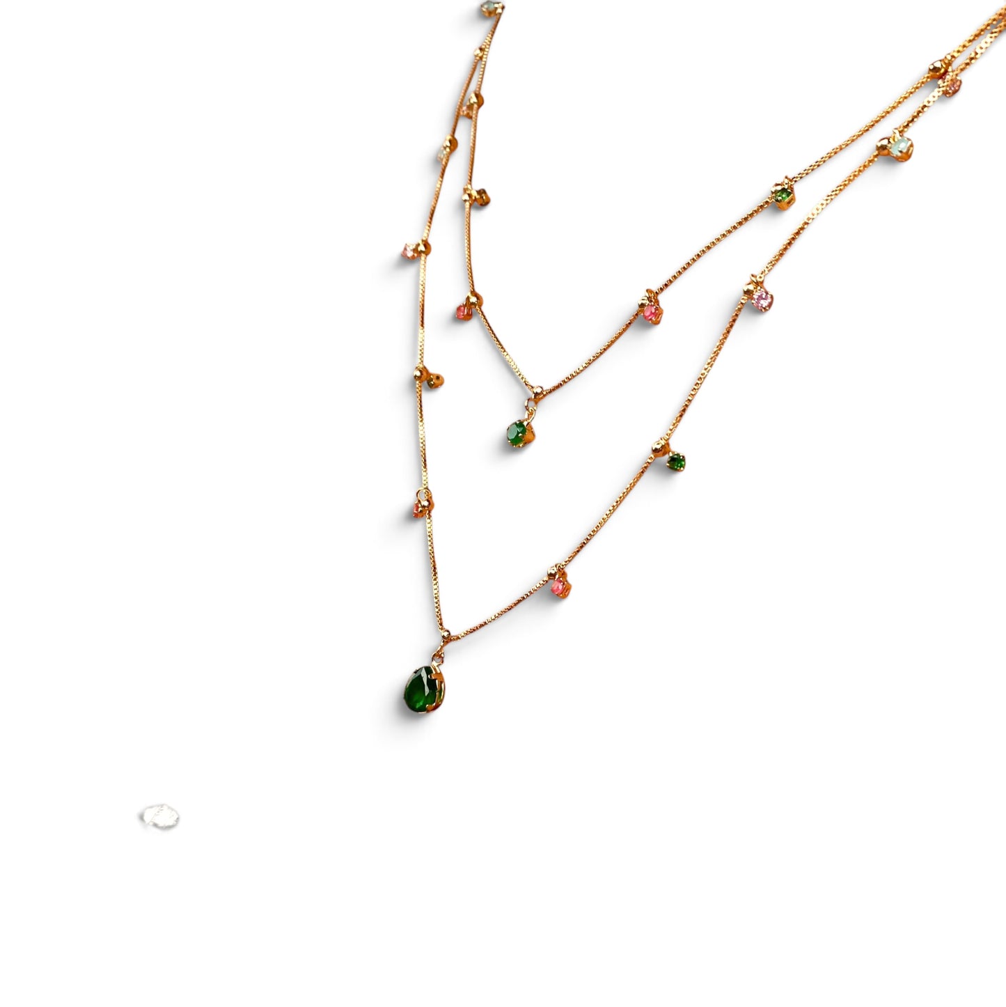 A double-strand gold chain necklace with small colorful gemstone beads and a teardrop-shaped green pendant, displayed on a clean white background.
