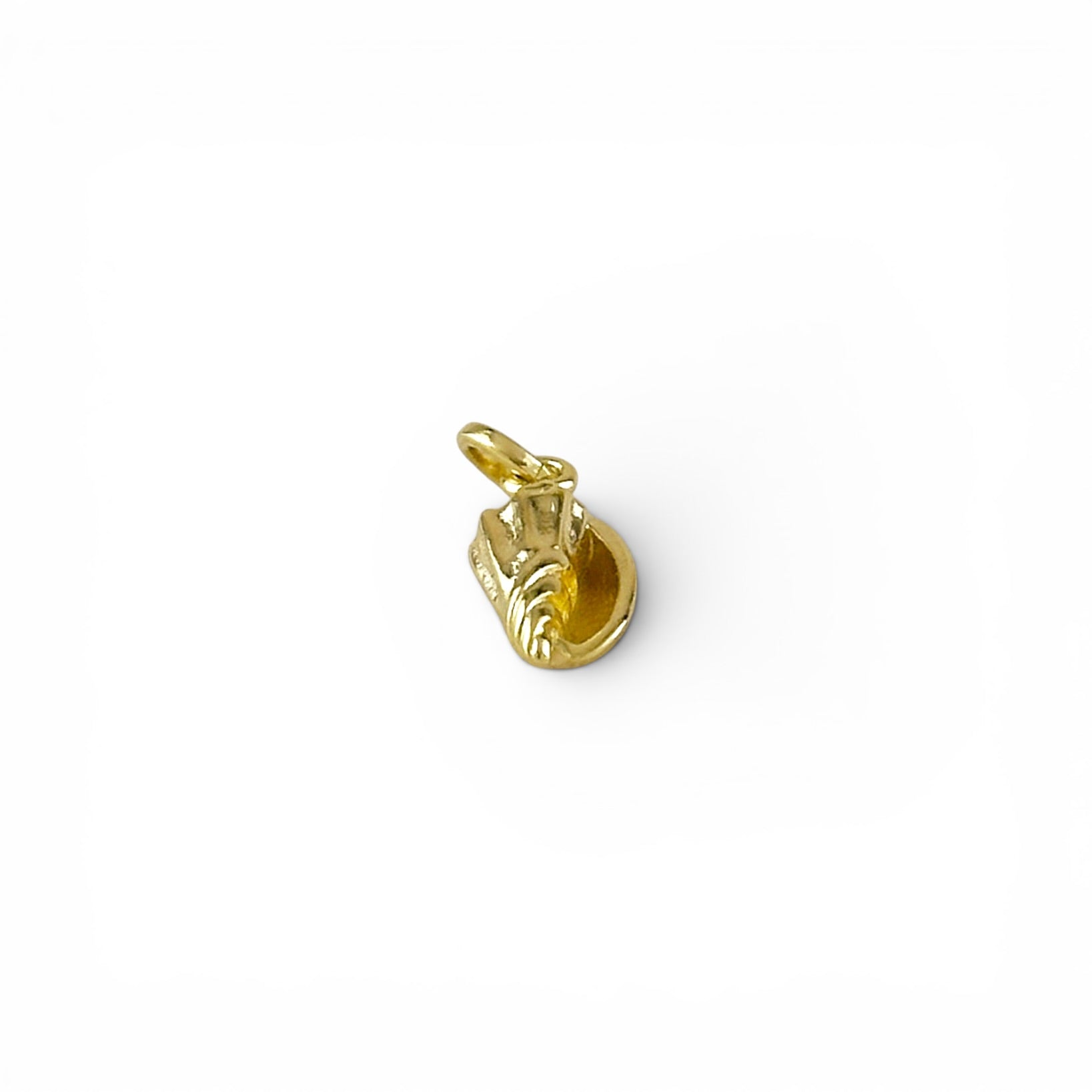 Close-up of detailed texture on conch shell charm