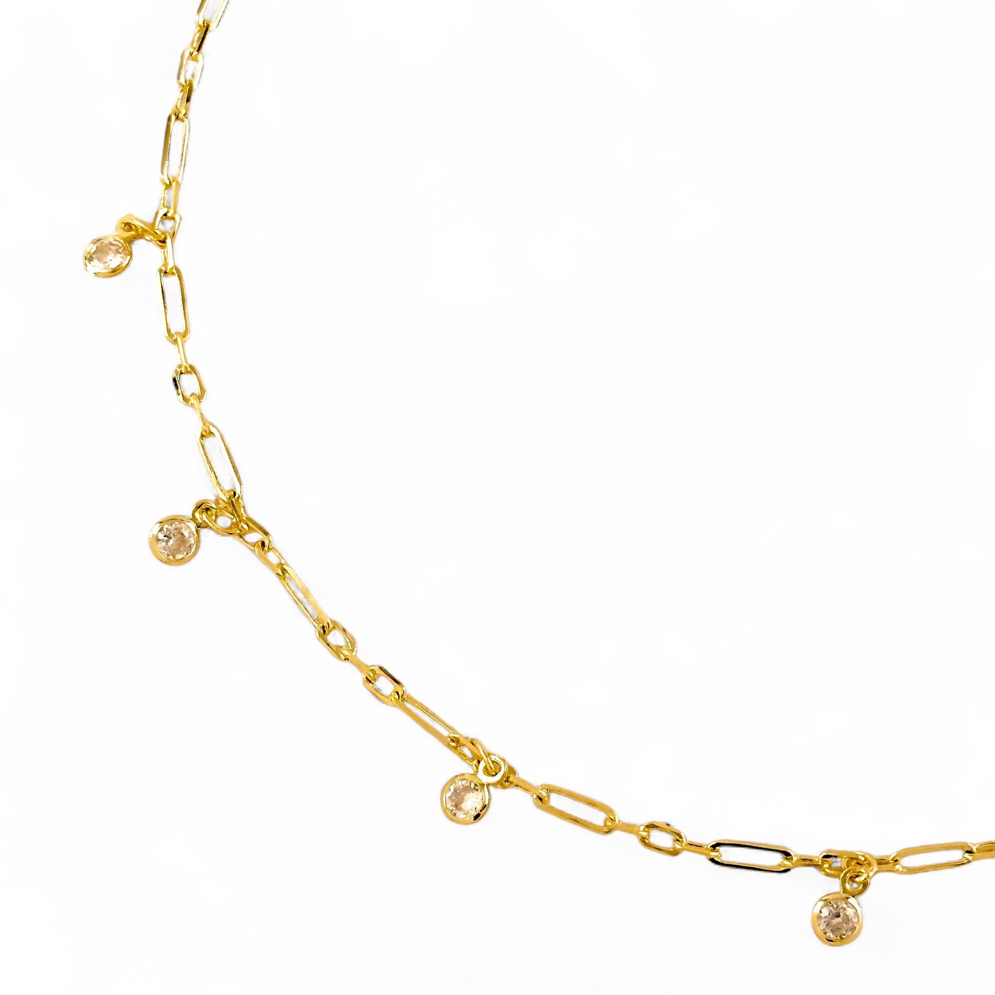 Close-up of paperclip links and dangling CZ on belly chain