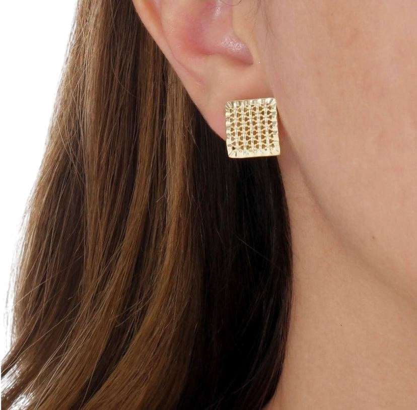 Close-up of square stud earring on model