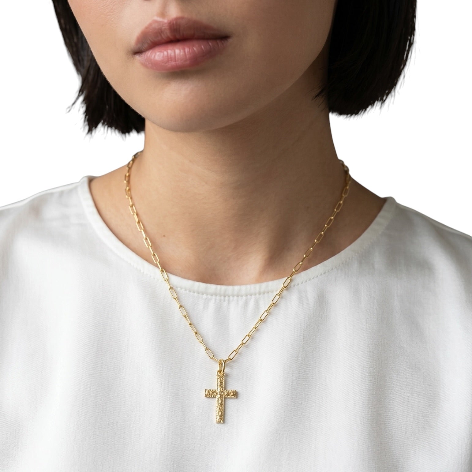 Engraved cross charm styled on model