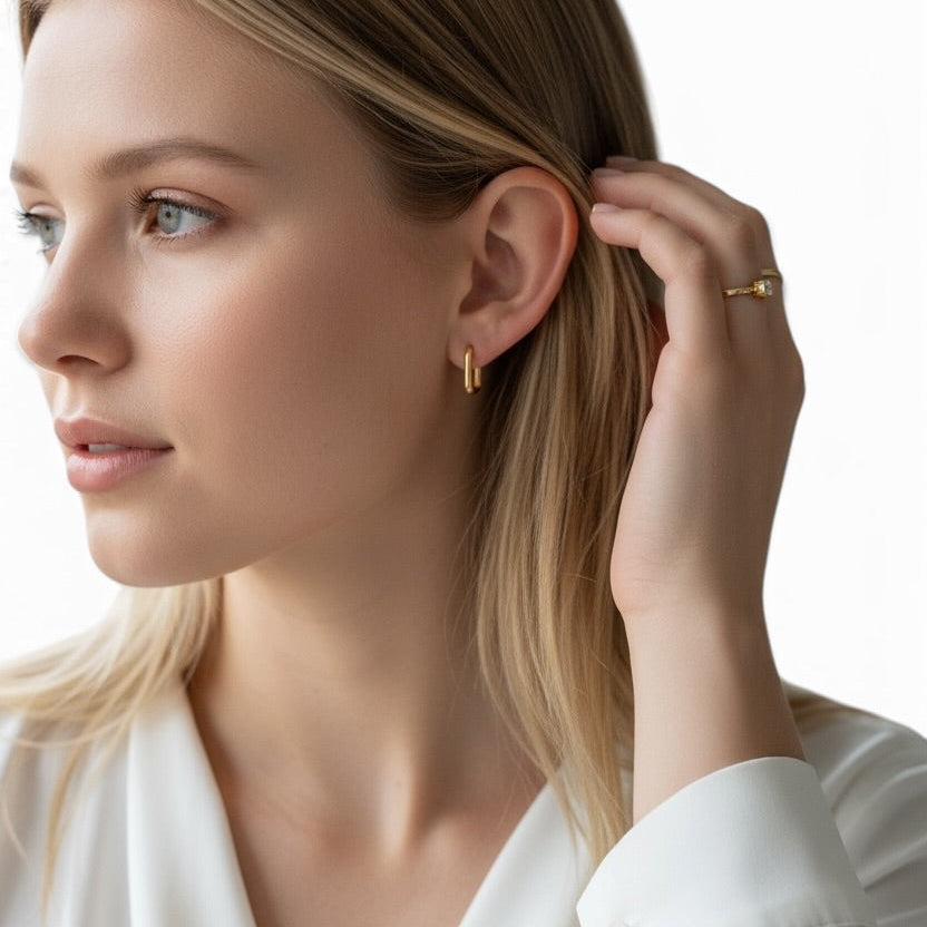 Model wearing skillus Oblong Huggie Hoop Earrings