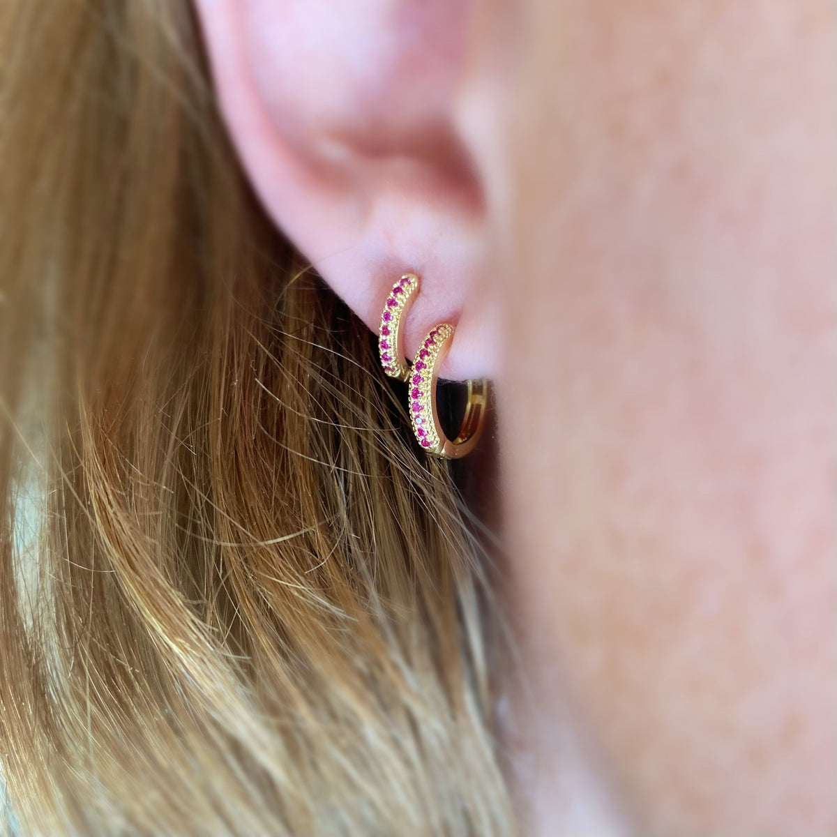 Fuchsia CZ Huggie 18K Gold Filled Hoop Earrings on Model