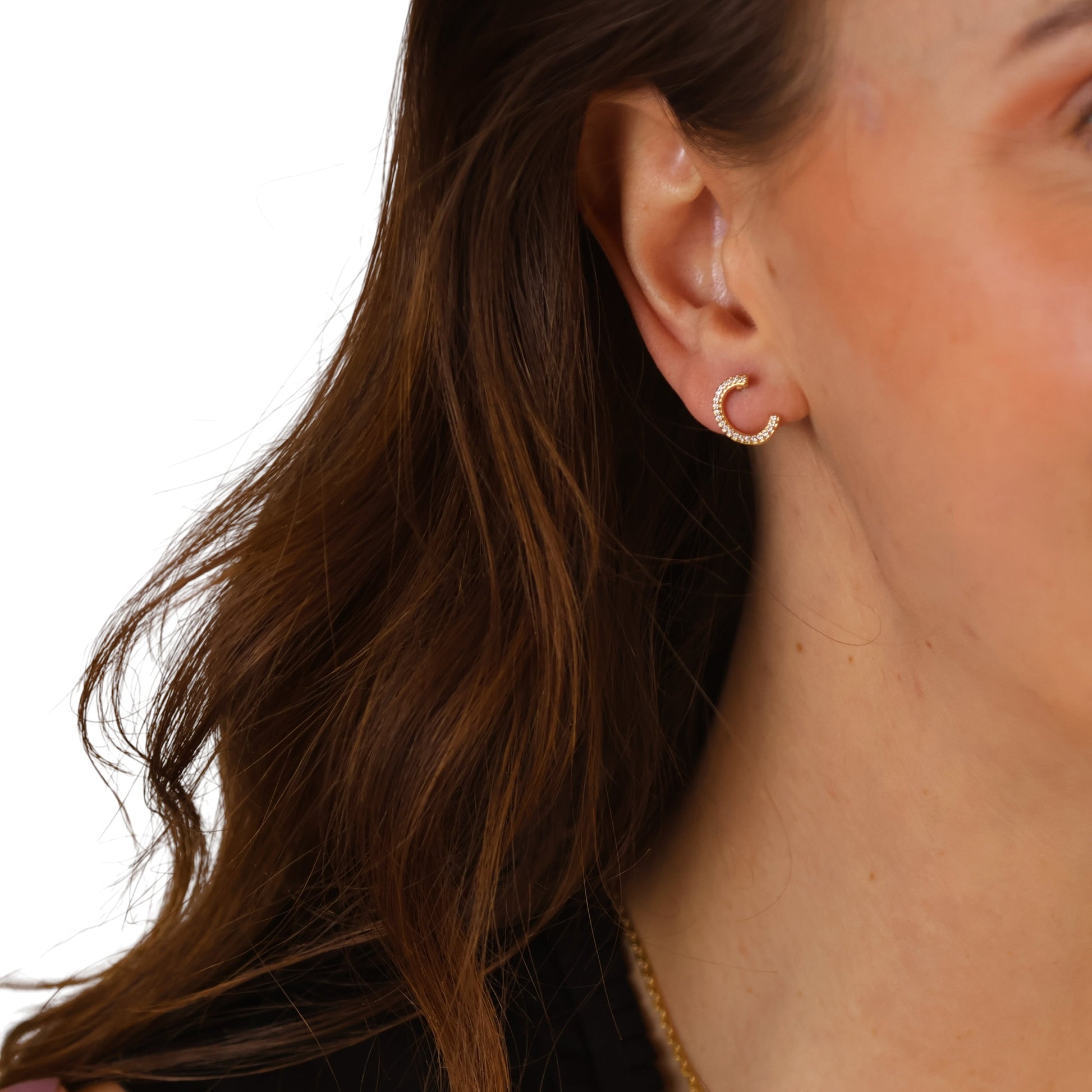 Half-moon studs styled on ear