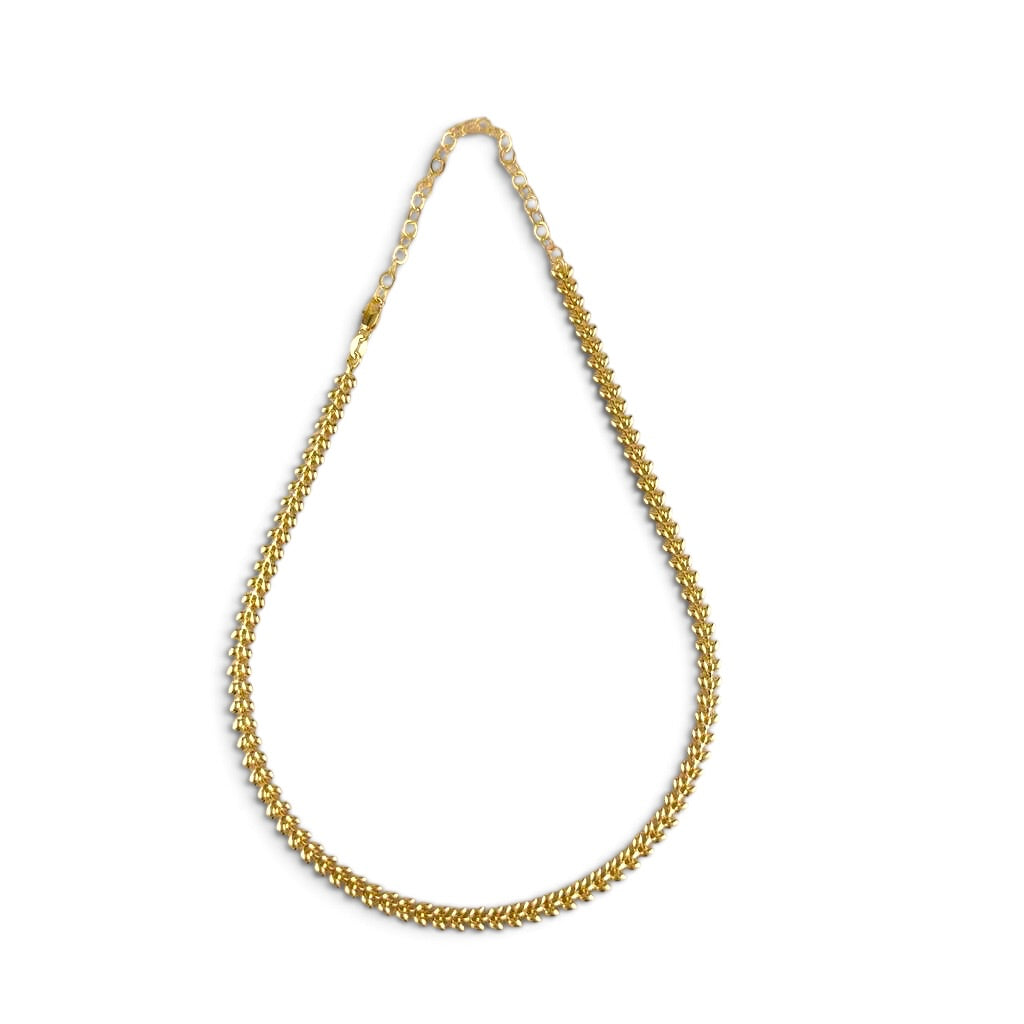 A gold chain necklace with a textured, woven link design, displayed in a teardrop shape against a plain white background.