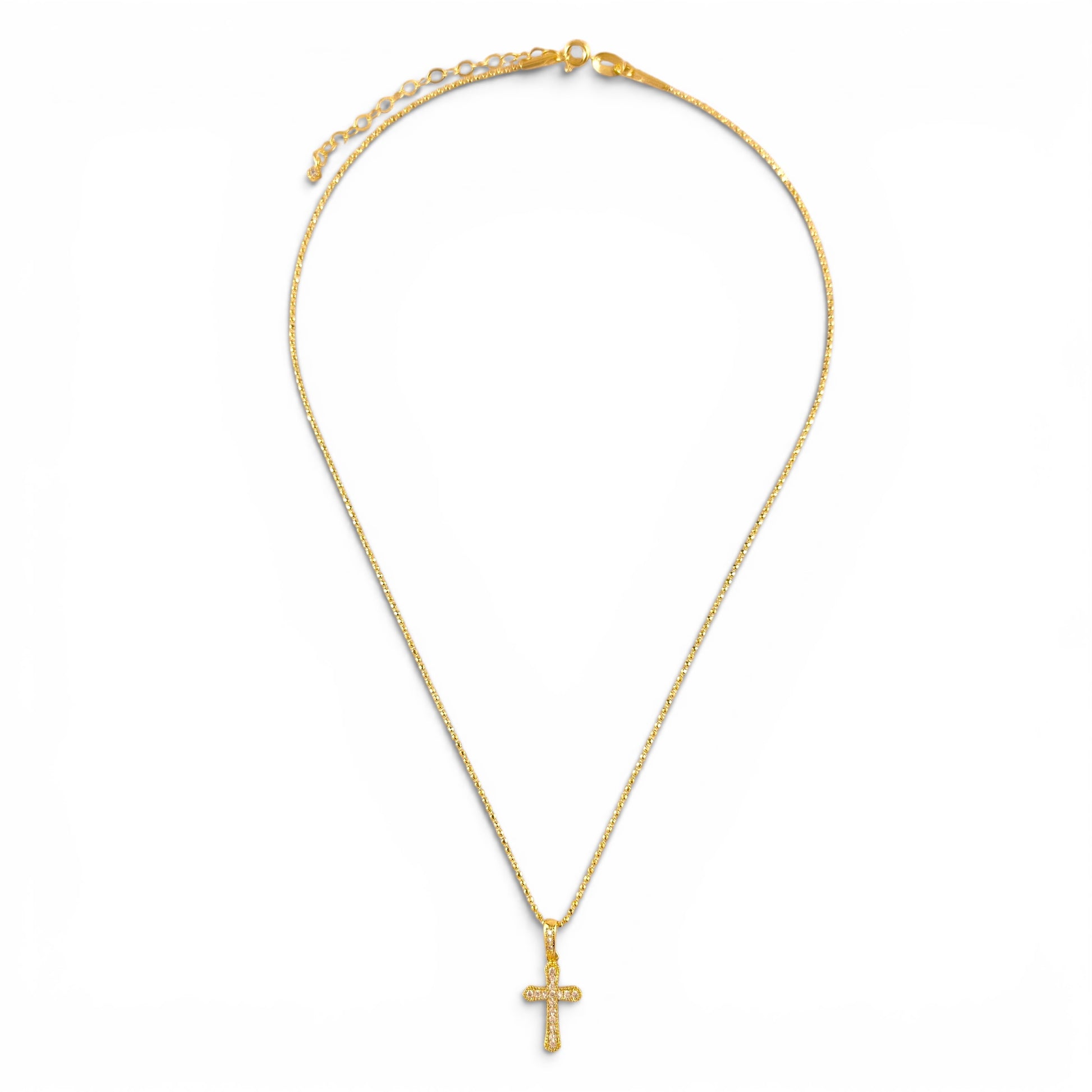 Pavé cross necklace showing delicate beaded chain