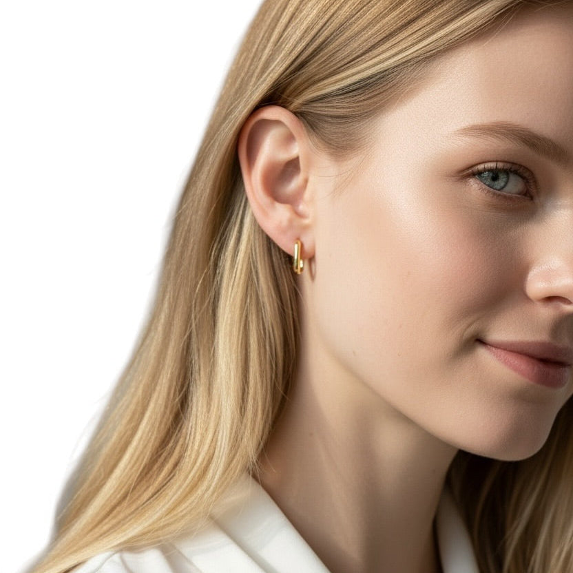 Skillus Oblong Huggie Hoop Earrings on woman