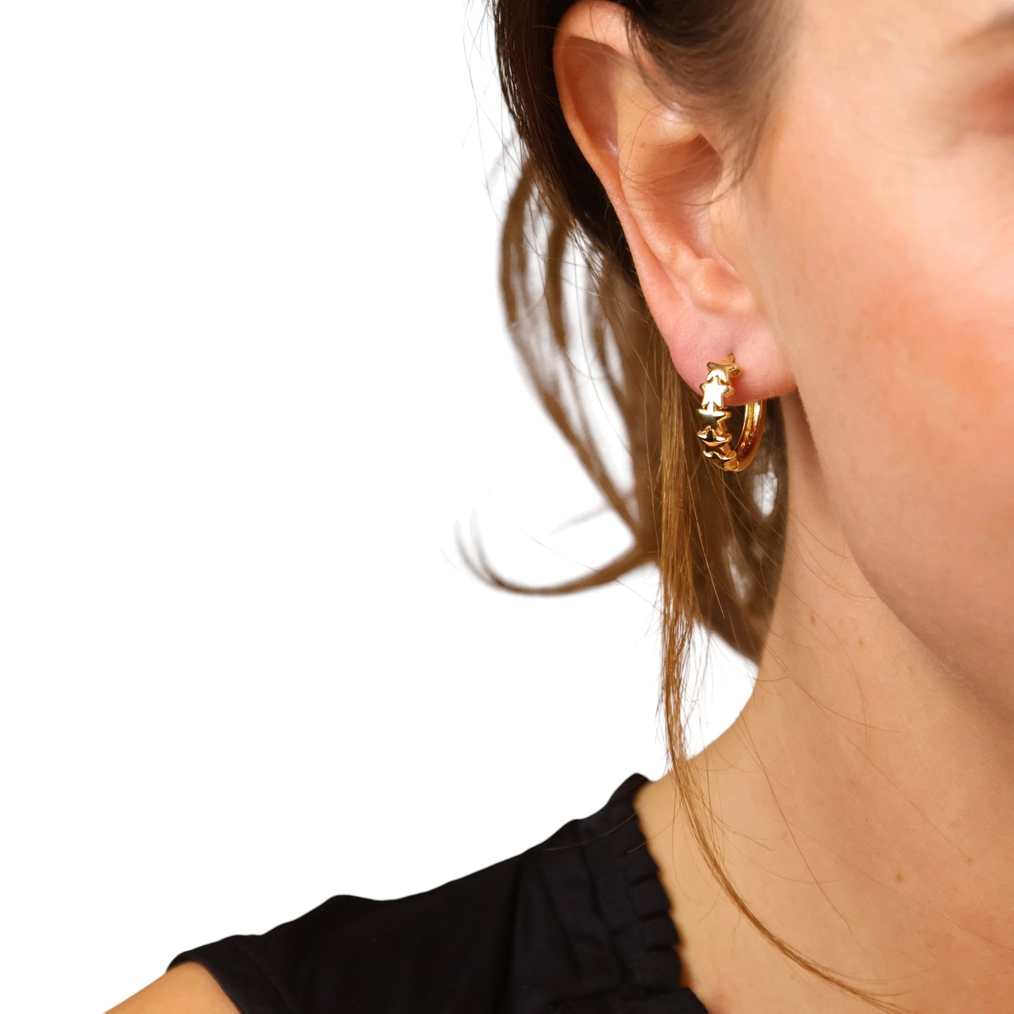 Skillus Star Huggie Hoop Earrings on Woman