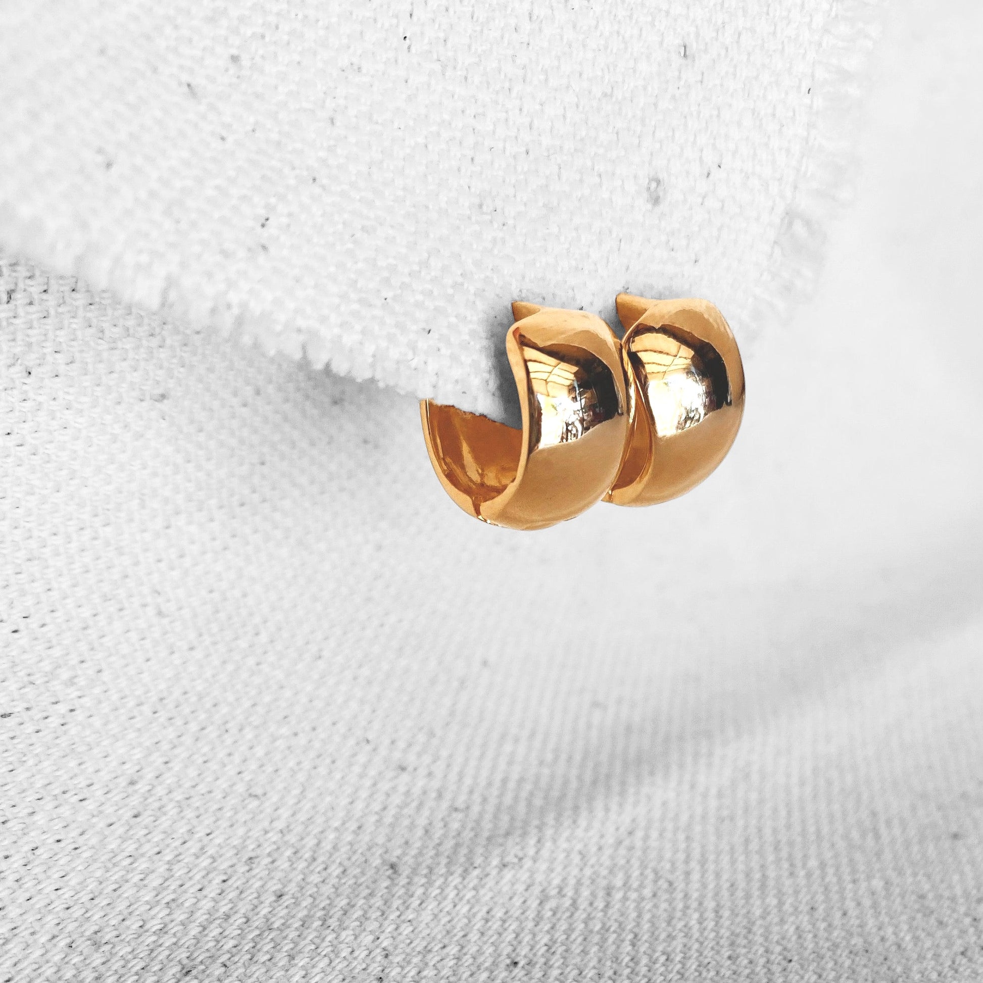 Skillus Wide Huggie 10mm 18K Gold Filled Hoop Earrings on display