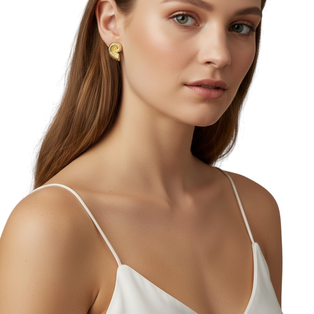 Close-up of ridged nautilus spiral texture on stud earrings